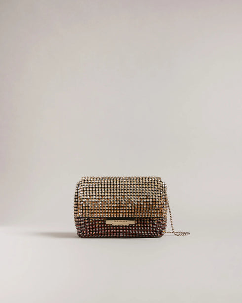 GLITERI-Bags-It's time to sparkle. Make a statement wherever you go with our sparkling GLITERI bag. Adorned with all-over crystals, this bag is sure to turn heads and add plenty of glamour to any outfit. The chain shoulder strap is both comfortable and adjustable, while the magnetic closure keeps your essentials secure. With an internal pocket for added organization, this bag is both practical and eye-catching. Crossbody bag All-over crystals Chain shoulder strap Magnetic closure Internal pocket Dimensions: